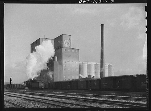 Grain elevator and mill at a railroad siding of the...