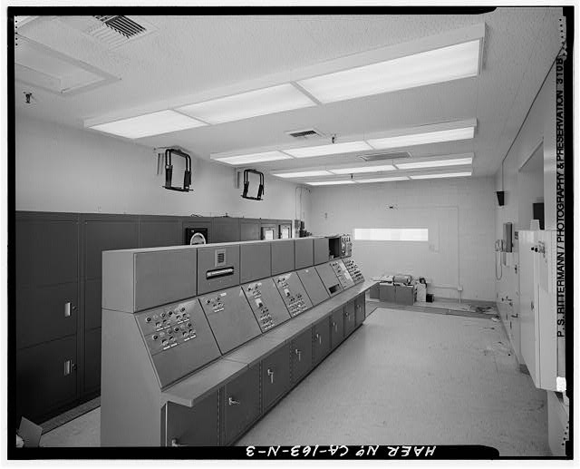3. Credit BG. The interior of the control room appears in...