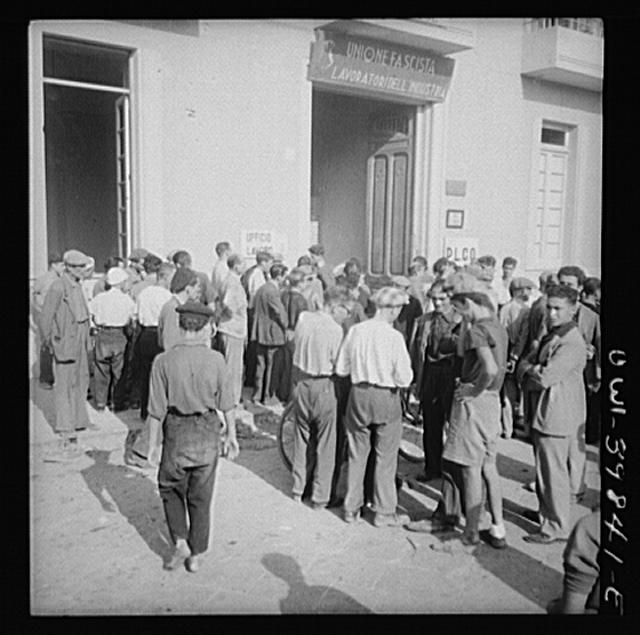 Messina, Sicily. Workers outside the labor office where...