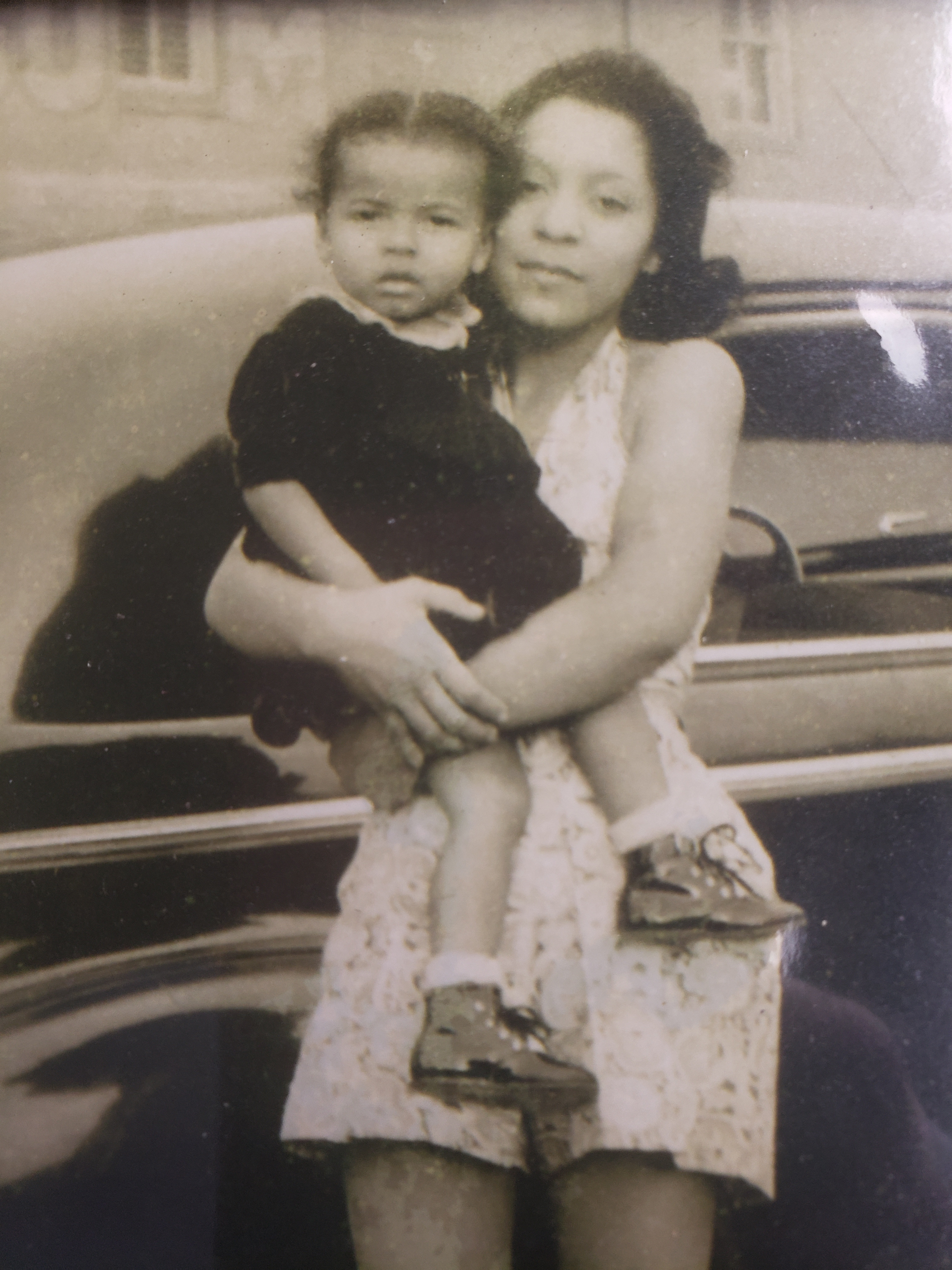 Grandma Dottie in Manhattan in the 1940s holding her neighbors daughter 