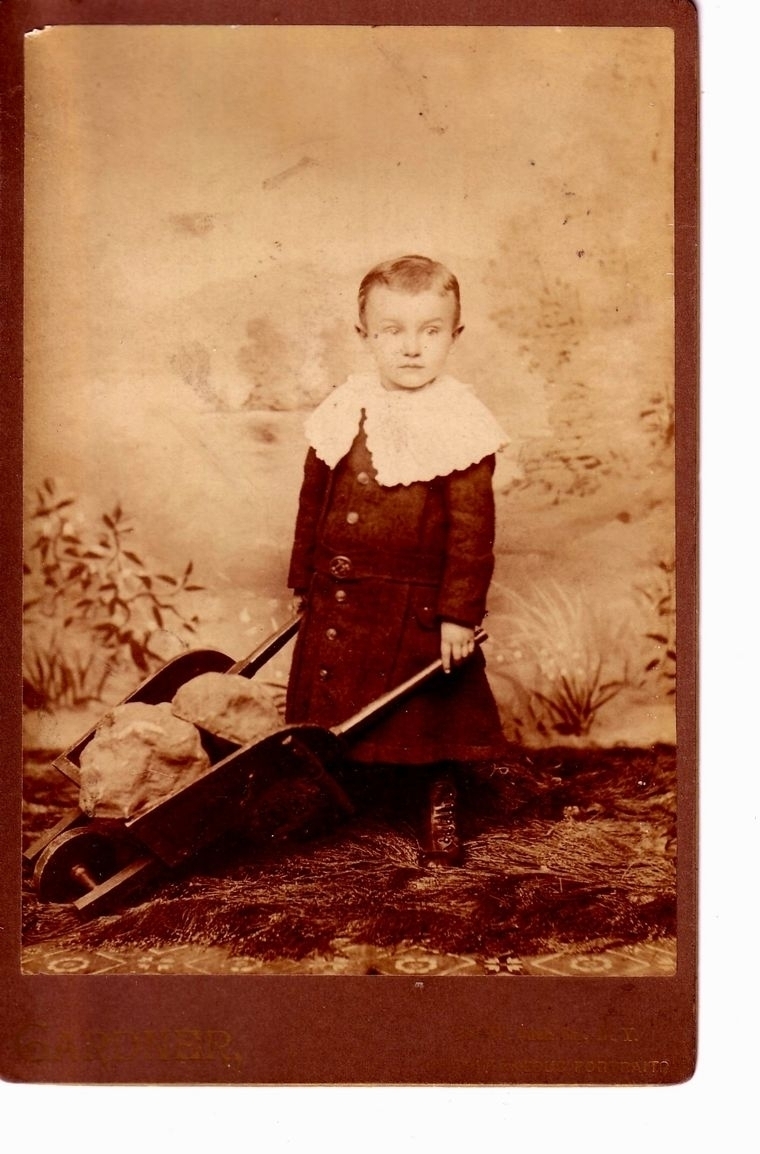 Young child with wheelbarrow