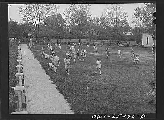 San Augustine, Texas. Easter egg hunt on the school lawn...