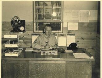 William J. Pesta Sr., First Sergeant, At His Desk