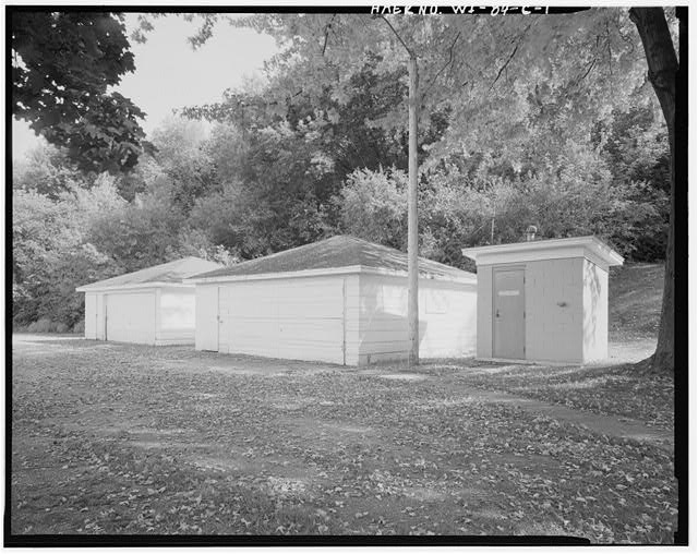 1. VIEW EAST/SOUTHEAST, Garages on left, sanitary...