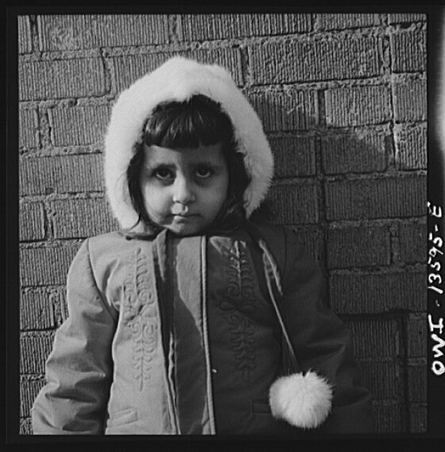 New York, New York. Child on Mott Street on Sunday
