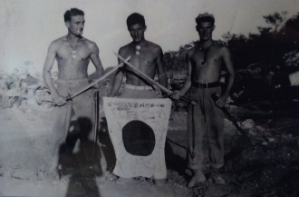 Displaying captured swords and flag. Okinawa spring 1945 