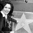 Pointing to her Star in Hollywood.