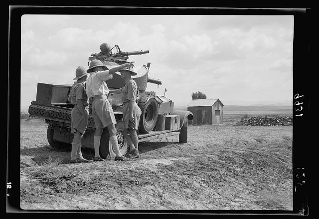 R.A.F. activities. Armoured car officer giving...