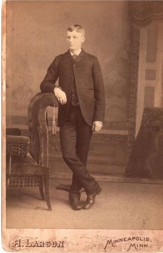 Young Man leaning on Sofa