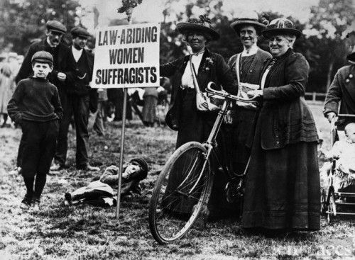 Suffragettes Cycling to a Meeting