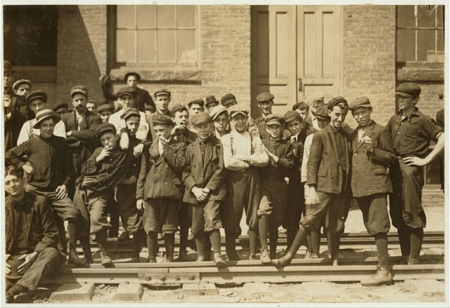 Group in front of Indian Mfg. Co. Everyone in photo was...
