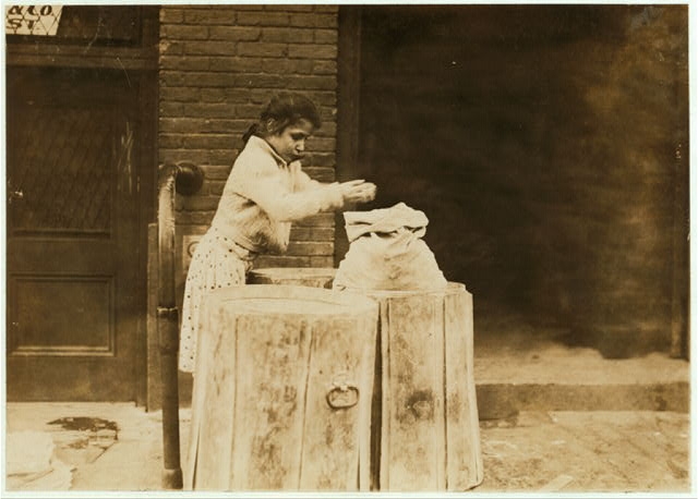 Picking over ash barrels. Boston, Mass., Oct. 1909. L.W....