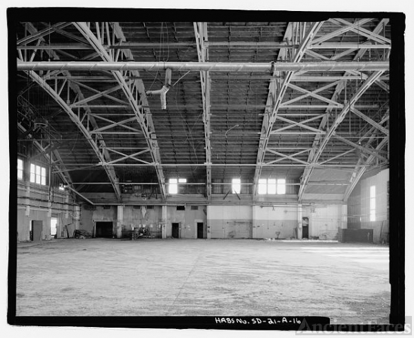 16. Hangar interior showing roof trusses, concrete beam,...