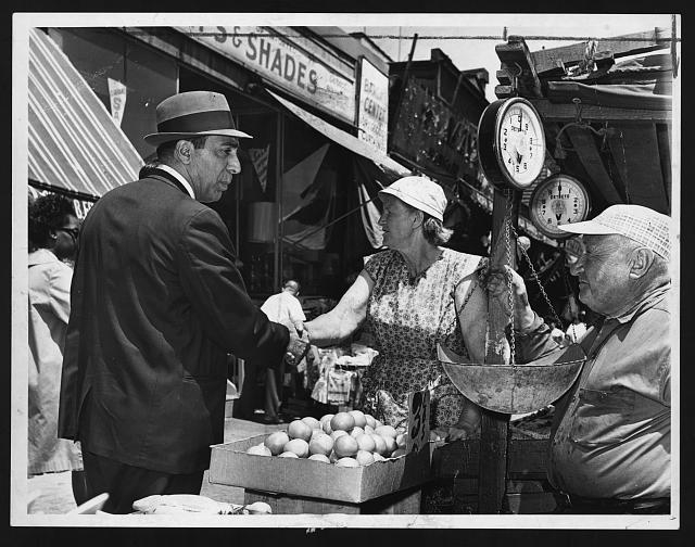 Markets Commissioner Albert S. Pacetta chats with vendor...