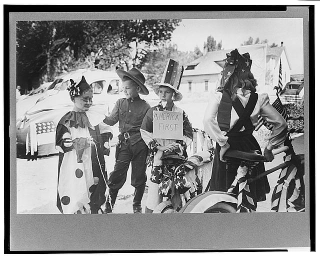 Bicycle riders in parade on the Fourth of July at Vale,...
