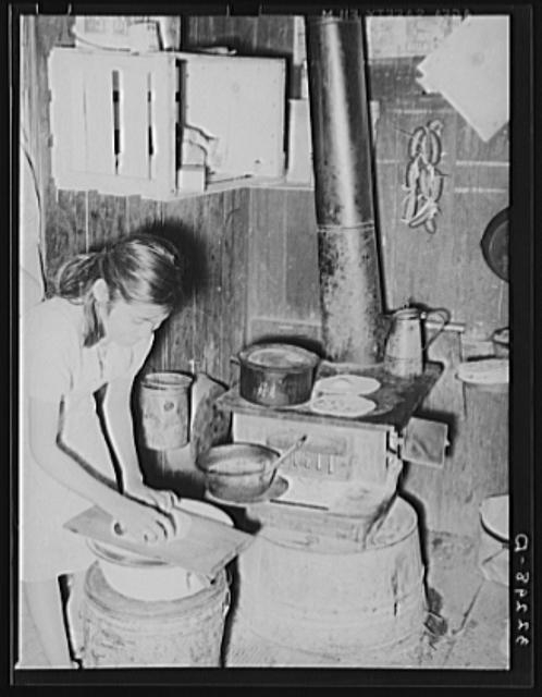Mexican girl living in corral making tortillas. Tortillas...