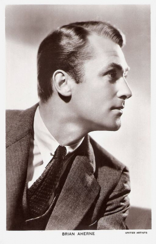 Brian Aherne in profile.