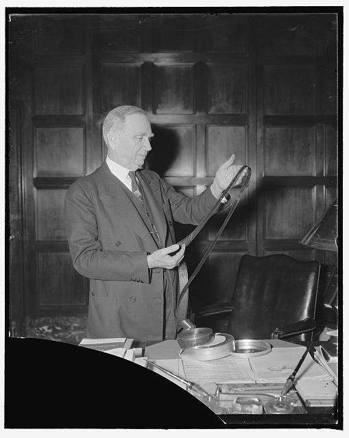 Sec. of Commerce Daniel Roper, with movie strip of the...