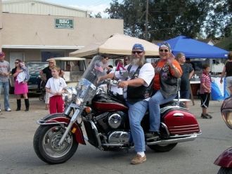 John and Mary on their motorcycle in a Parade for Lepanto's Turpin Derby Day