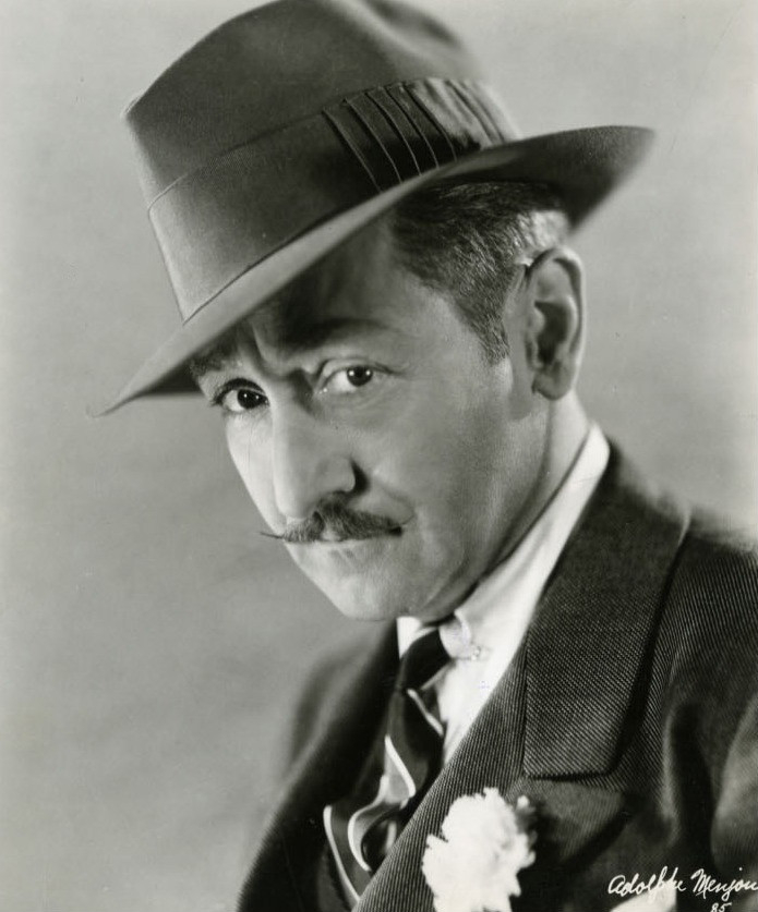 Adolphe Menjou.