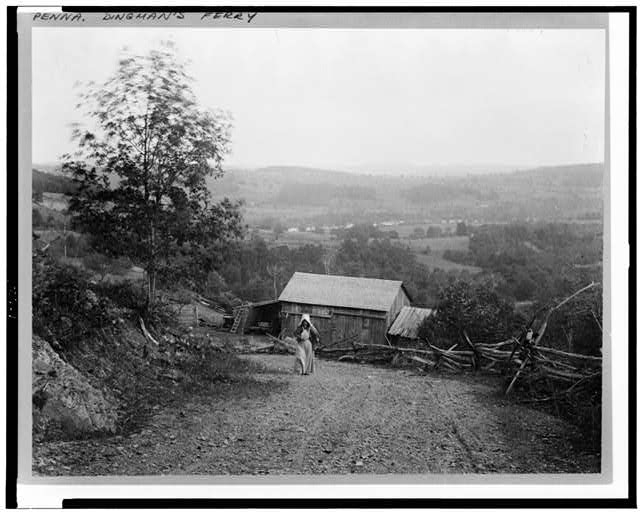 [Landscape with woman walking up hill, barn below, and...