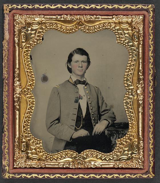 [Unidentified soldier in Confederate frock coat with gold...