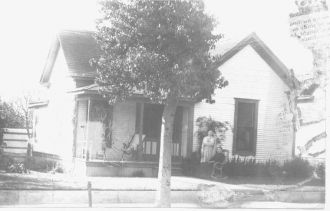 Ladies in front of house