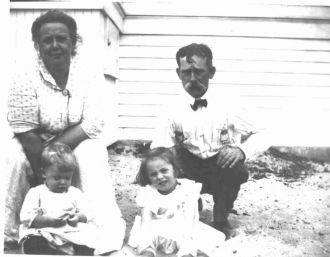 Annie and John Slyoff and grandchildren