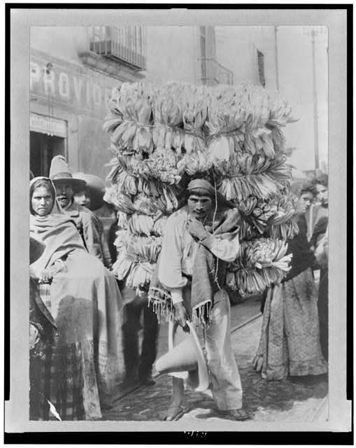 Man peddling corn husks to be used as wrapping paper