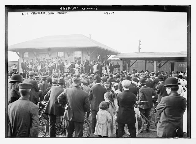 L.S. Chandler, on platform speaking to crowd, Sag Harbor