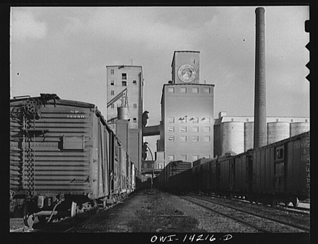 Grain elevator and mill at a railroad siding of the...