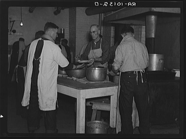 Inmates working in the kitchen of homeless men's bureau....