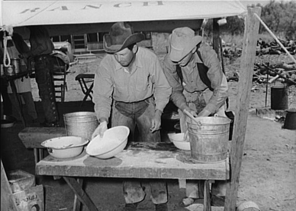 Cowboys washing up before eating