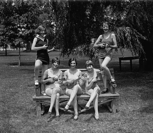 Women in bathing suits with ukuleles