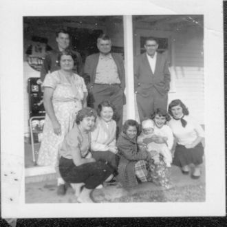 Family in front of Store