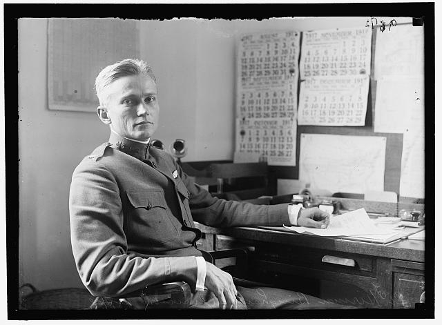 BINGHAM, HIRAM, AVIATOR. AT DESK