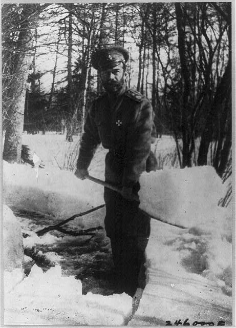 Emperor Nicholas II shovelling snow in the park at...