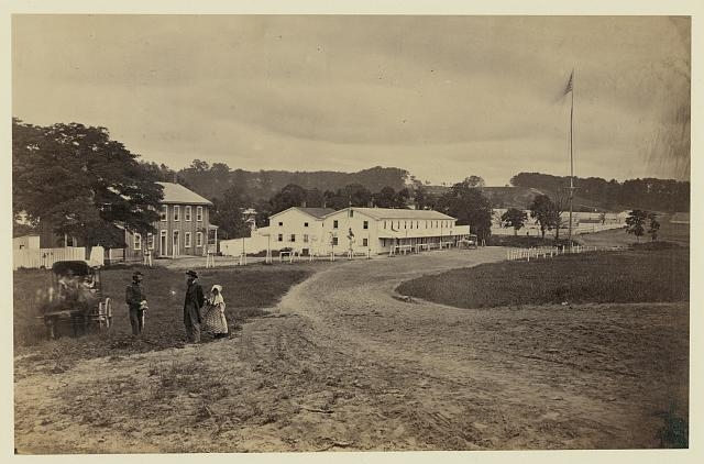 [Cavalry depot at Giesboro, Md. Soldier facing man and...