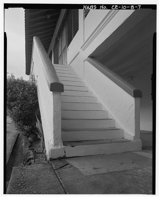 Detail of front entry stairs showing original boot scrape...