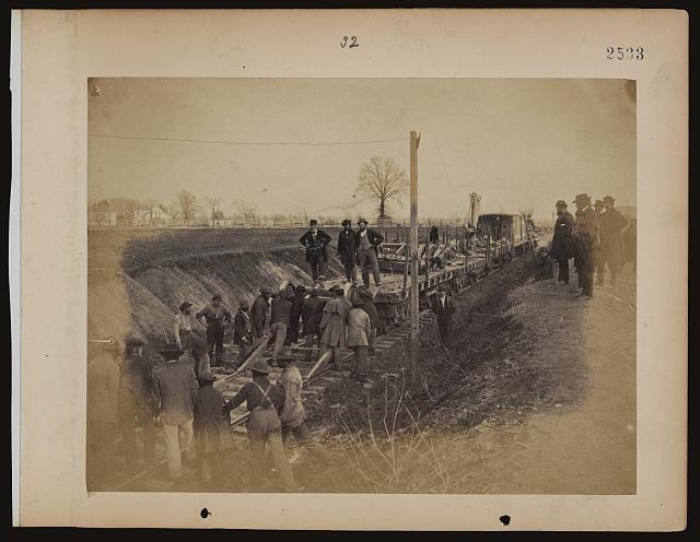 Wrecking train and gang clearing wreck