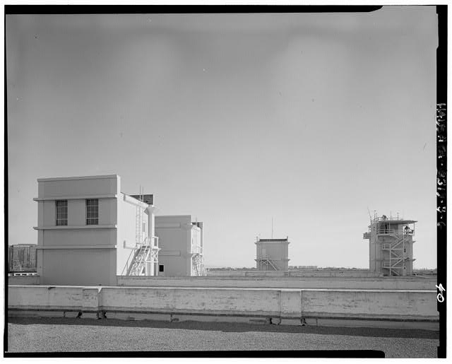 Building, roof, with machinery penthouses on left and...