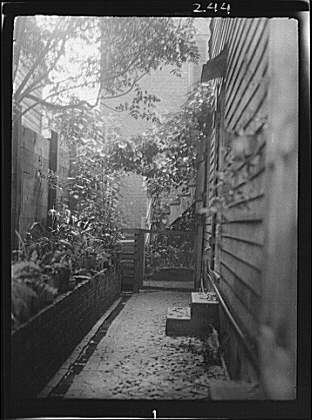 View down narrow outdoor passageway, New Orleans or...