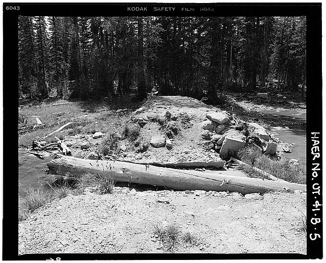 5. VIEW OF BREACHED CONCRETE SPILLWAY, LOOKING NORTHEAST...