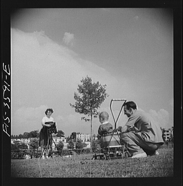 Greenbelt, Maryland. Parents taking baby's picture on Sunday