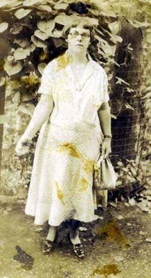 Lady Feeding Chickens