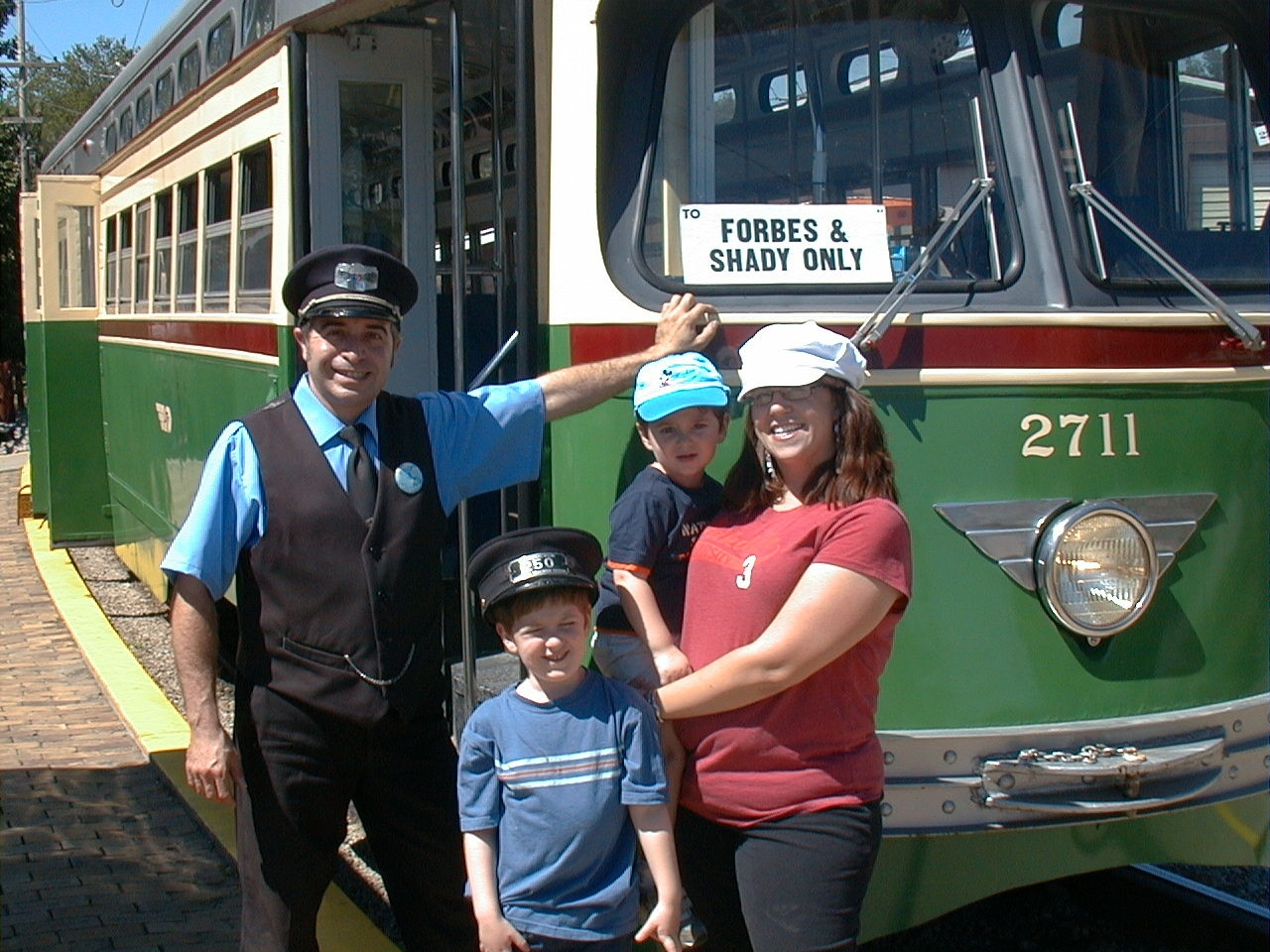 YOUNG FAMILY ENJOYS A RIDE ON THE "T" WITH "MR CONDUCTOR"