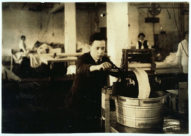 Edward McGurin, 14 years old. Wringing curtains at...