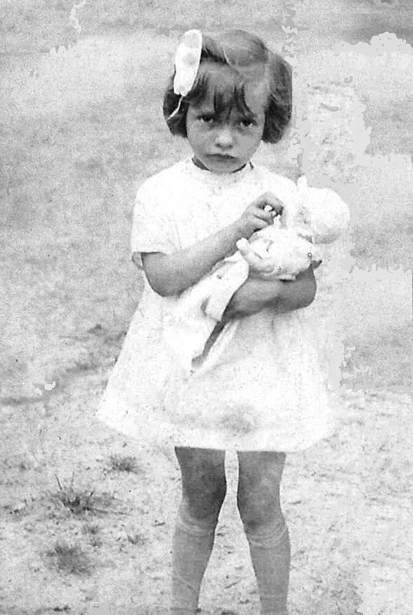 Arlette with her doll.