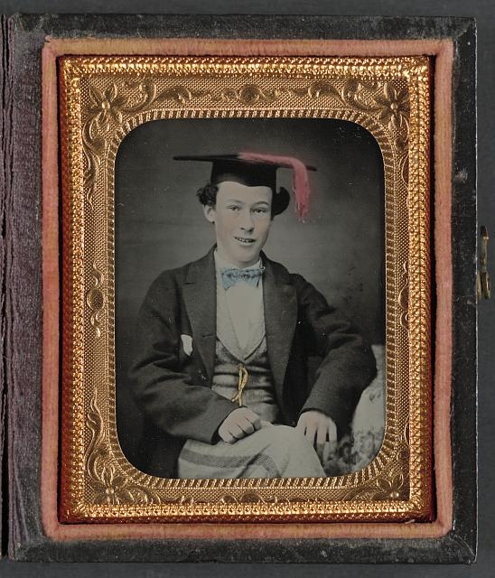 [Unidentified graduating cadet in military trousers and...