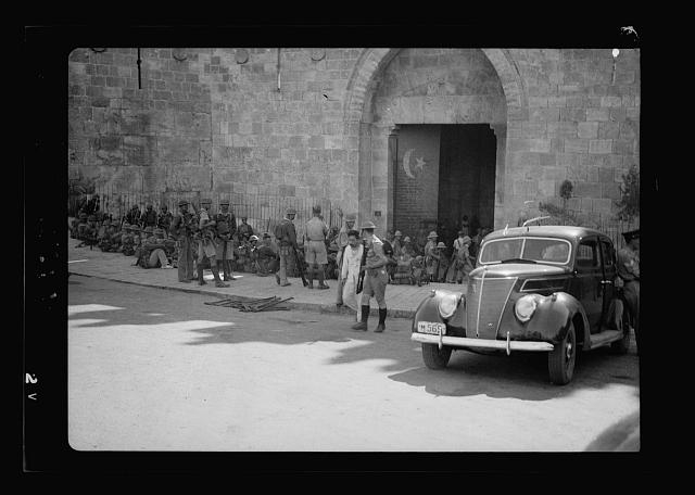 Damascus Gate. Arab escorted out through the gate